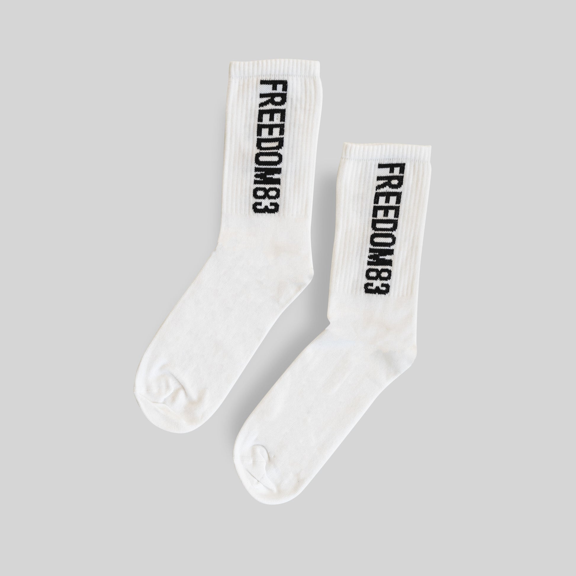 F83 Crew Socks White — Freedom 83 logo crew sock pair